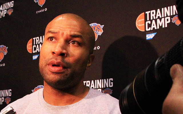 Coach Derek Fisher takes questions from the media.