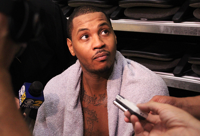Carmelo Anthony taking questions after practice.